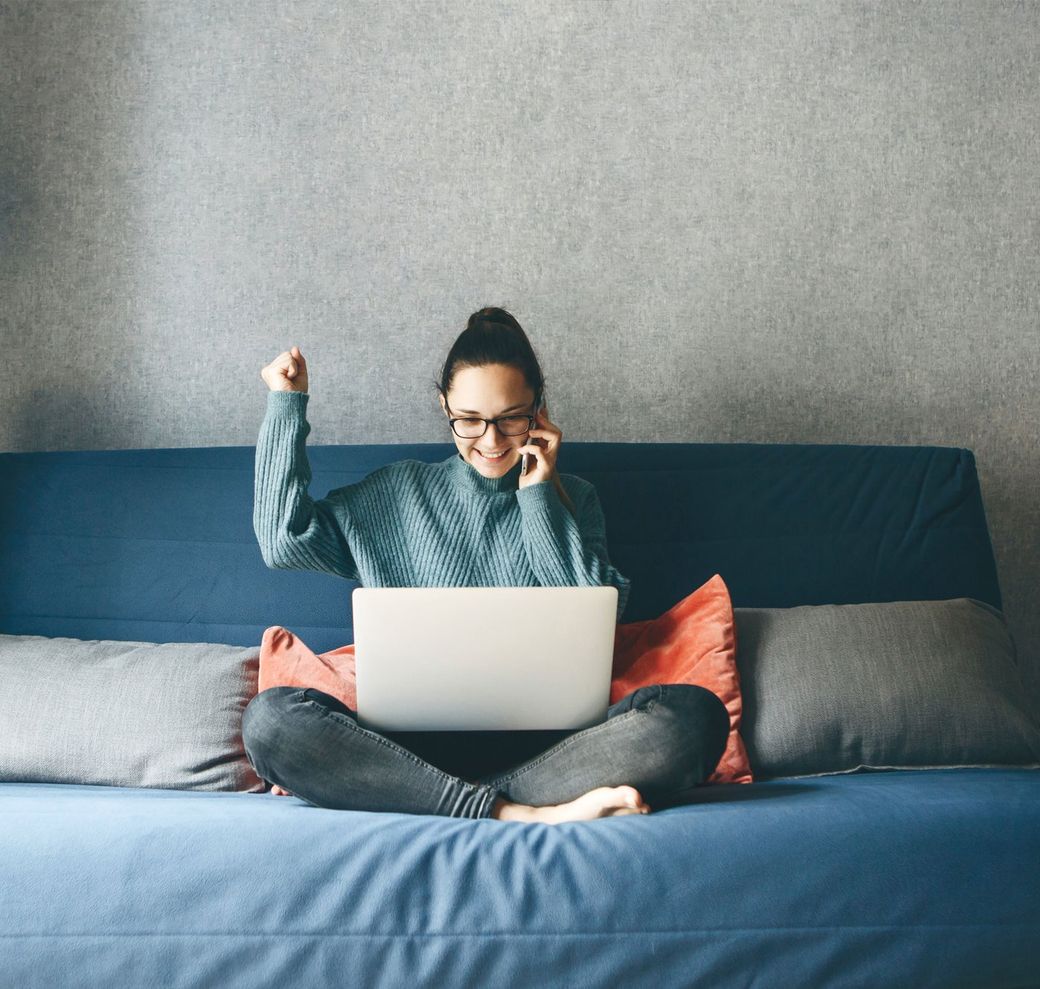 A client sending documents from home while on the phone
